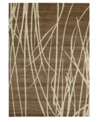 Blades of tall marsh grass sway in silhouette across a field of organic brown. Carefully woven using textured yarns combined with a distinct palette of rich, blended earth tones, this Calvin Klein makes modern design accessible to everyone.