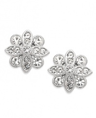 Flower power! Pretty petals and glittering crystals join together to make a striking statement on Eliot Danori's stud earrings. Set in silver tone mixed metal. Approximate diameter: 1/2 inch.