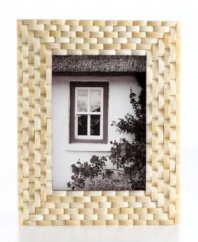 Naturally chic, this Purva picture frame features a thick woven pattern in pure bone, elevating decor with unconventional style and rich texture.