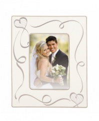 Preserve your most romantic moment in the True Love picture frame from Lenox. Loopy hearts adorn graceful ivory porcelain, a beautiful showcase for wedding or engagement photos. Qualifies for Rebate