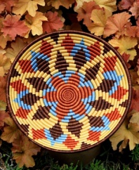 Inspired by the sun-drenched landscape of Rwanda, this meticulously handcrafted bowl rejuvenates decor with vibrant shades and geometric shapes. A thoughtful gift and striking accent piece for your wall or coffee table.