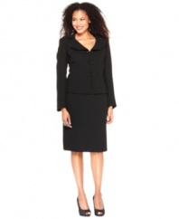 Le Suit's black skirt suit is jazzed up with beaded trim at the collar and beaded double button closures at the front of the jacket. Finish the look with your own brilliant baubles.