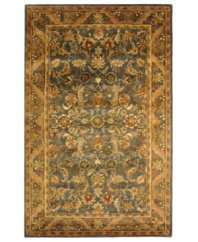 A special herbal wash gives Safavieh's Antiquity rug its aged patina and irresistibly lustrous finish. A plumed floral motif adorns this hand-tufted rug in a shimmering blue and warm gold palette, accenting your home with classic elegance. (Clearance)