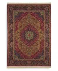 Inspired by the distinctive and beautiful textiles of the Kirman region in ancient Persia, this rug features a curvilinear medallion design upon a field embellished with arabesques and floral motifs. Patterned after a nineteenth-century Kirman rug, it makes use of borders to showcase a spectrum of colors such as indigo blue, brick reds, tobacco golds, browns and olives - with a smattering of soft aqua, coral and burgundy. Each color is specially dyed for a timeworn striated effect that recreates the antique beauty of the original. Woven in the USA of luxuriously soft premium worsted New Zealand wool.