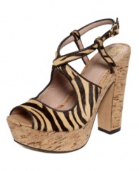 Set your inner wild child free when you step into Vince Camuto's safari-chic Deville Platform Sandals. Sultry zebra-print straps and a towering cork platform create a look that's perfect for prowling.