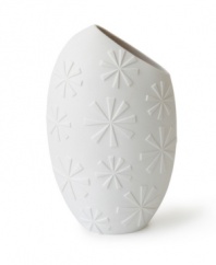 A modern shape and askew opening in matte white porcelain make the Charade Slice vase from Jonathan Adler a must for artful arrangements.