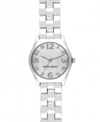 A clean and classic design with a charming twist, by Nine West. Watch crafted of silver tone mixed metal bracelet and round case. Silver tone dial features applied numerals, hour and minute hands, sweeping second hand and logo at six o'clock. Quartz movement. Limited lifetime warranty.