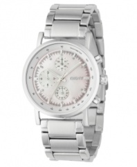 A pretty take on a classic chronograph. Brushed and polished stainless steel bracelet and case. Tachymeter bezel. White mother-of-pearl dial with logo, three subdials and shiny silvertone indexes with twinkling crystals. Three hands. Quartz movement. Water resistant to 50 meters. Two-year limited warranty.