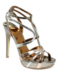 A marvel in metallic. Luminous patent leather straps light up the Monalee platform sandals by Ivanka Trump.