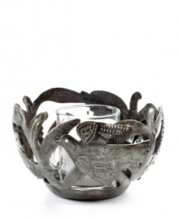 Hand cut and hammered by artist Michaelson, the Fire Bird votive holder accompanies flickering candlelight with intricate birds and branches. Steel from recycled barrels gives each one-of-a-kind piece a rustic beauty perfected by Haiti's esteemed artisans.