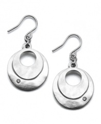 Two silvertone disks glimmer like the moon on these modern Kenneth Cole New York earrings. Crafted in silvertone mixed metal and crystal accents. Approximate drop: 1 inch.
