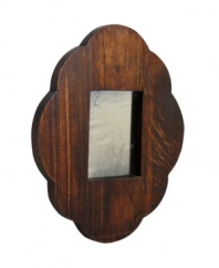 A feminine scalloped edge contrasts a chunky wood design, making the Scallop and Square mirror by Regina Andrew an utterly charming addition to any master suite.