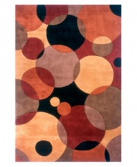 Abstract and absorbing, this rug features a multi-circle pattern in lavender, terra cotta, black, peach and burgundy. Reminiscent of modern art paintings, it adds striking modernity and grace to your home. Hand-tufted and hand-carved of plush wool.