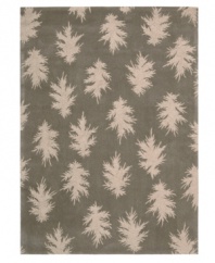 Falling leaves impart jagged-edged style balanced by a solid carbon background. Hand tufted from 100% natural wool, this plush Calvin Klein rug is crafted using the cut-and-loop pile technique that creates a unique matte surface texture.