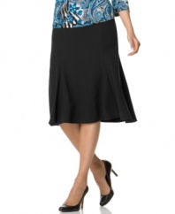 This solid stretch skirt from JM Collection flares at the hem to add volume and movement to this floaty silhouette.