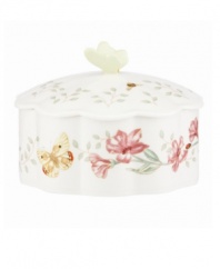 Spring is perpetually in season with the whimsical Butterfly Meadow trinket box from Lenox. Colorful blooms and butterflies on scalloped white porcelain lend country charm to any setting. Topped with a sculpted butterfly. Qualifies for Rebate