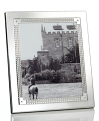 Engraved for timeless style in stainless steel and silver plate, the Watchband picture frame from Lauren Ralph Lauren is a sleek accessory for polished decor.