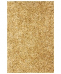 Add rich, shimmering texture to any modern room with the Metallic beige area rug from Dalyn. Hand-tufted of soft polyester, this high-luster shag area rug puts comfort and fun back in floor decor.