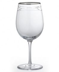 Commemorate a special anniversary with a simply elegant reminder of the time you said, I do. This radiant crystal goblet is hand-engraved with interlocking bands that symbolize the rings exchanged between bride and groom. A platinum rim provides a graceful finish.