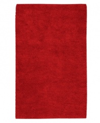 Red alert. A vivid hue makes a bold statement in any space, punctuating your decor in striking style. Hand-woven in India, this plush area rug from Surya is luxuriously rendered in indulgently soft New Zealand felted wool.