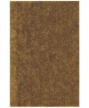 Add rich, shimmering gold texture to any modern room with the Metallic area rug from Dalyn. Hand-tufted of soft polyester, this high-luster shag area rug puts comfort and fun back in floor decor.