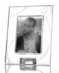 Fall for the elegant True Love giftware collection. A crystal picture frame etched with a romantic heart design is a sweet way to commemorate a special anniversary or congratulate the bride and groom. Qualifies for Rebate