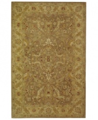 Embrace the antique beauty and the earthy elegance of this exquisite area rug from Safavieh. Tufted in India from pure wool, this rug emerges from the annals of antiquity to bring spectacular style and time-honored quality to your home. (Clearance)