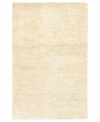 Step onto a cloud-soft area rug in rich, felted ivory wool. Offering one of the thickest, plushest hands in the industry, the Surya Metropolitan area rug billows with softness in every space.