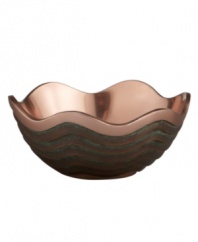 Featuring a bold new look for Nambe's signature metal, the Copper Canyon bowl captures the striking beauty of the American southwest in brilliant copper. A rippled shape inspired by the region's wind- and water-worn canyons is finished with a rustic green patina.
