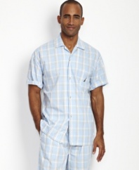 Change up your everyday evening look with this bright plaid camp shirt from Nautica.