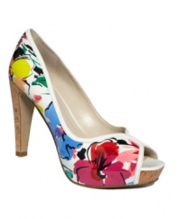 Put a spring in your step. The JustJoshin peep-toe pumps by Nine West shine with a floral print and earthy cork heel.