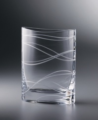 Inspired by the shape of a common shirt pocket, this stunning crystal vase bears an uncommon beauty. From acclaimed designer Karim Rashid, the rectangular vase stands 9-1/2 tall with curved sides and intertwining cut lines.