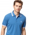 Not simply a polo.  Hugo Boss's take on this class warm weather staple is chic with collar and armband tipping and look great with jeans or khakis.