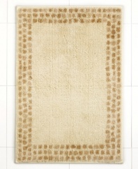 A breath of fresh air. Martha Stewart Collection revives your bathroom in carefree style with this Calendula bath rug, featuring a solid backdrop with a stripe border. Finished in soothing, neutral tones.