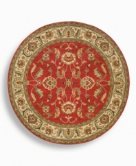 A larger-diameter round that is ideal for oversized rooms, this classic Agra rug features a scrolling vine design of oversized palmettes and serrated leaves. The green and ivory tones in the palmette border perfectly complement the dynamic color shadings of the rich red ground. Special color treatment creates a gentle finish. Woven of premium worsted New Zealand wool for indulgent softness.