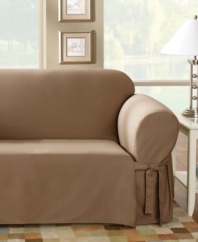 Dense cotton duck instantly transforms any furniture with its broad arm construction and an elegant draping at the bottom. Inner pleats minimize tucking, creating a streamlined, renewing finish. Available in a variety of hues.