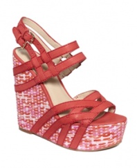 A darling sandal that hugs your feet. The Bardough wedge sandal by Nine West flaunts an elevated wedge wrapped with eye-catching straps, for non-stop style.