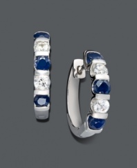 Hoop earrings with a colorful spin. Crafted in sterling silver, round-cut, channel-set, white and blue sapphires (3 ct. t.w.) create a vibrant look perfect for any occasion. Approximate diameter: 3/4 inch.