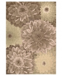 Plush texture. Sumptuous style. With meticulous hand carving, lush detail and a velvety soft finish, Nourison's hand-tufted rug from the Tropics collection delights the senses like never before. Oversized, ornately detailed florals bloom across this taupe and green rug for an exquisitely cultivated result.