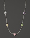 A rainbow of semi-precious, bezel-set gemstones dot this gleaming sterling silver chain. Each setting is unique.