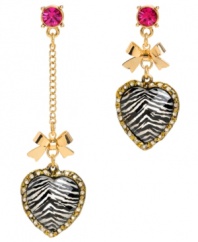 The fiercest of fashionistas. Betsey Johnson's mismatch earrings combine wild zebra stripes with 80s-influenced design. Crafted in gold tone mixed metal with bow accents and hot pink crystals. Approximate drops: 1-3/4 inches and 3 inches.