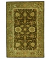 Traditional Turkish designs delight the eye in a winsome arabesque bordered motif, featuring vines, branches and blossoms flowing freely in rich green and brown tones. Pure wool is hand-tufted in a thick three-quarter-inch pile, finished with a cotton backing for long-lasting durability.