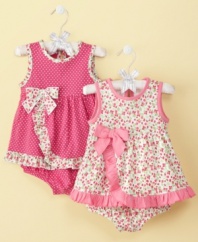 Sweet style! Get her ready to have fun in the sun with this adorably detailed sunsuit from First Impressions.
