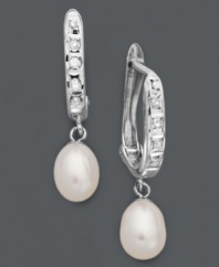 Totally refined. For a completely sophisticated look, just add these shimmering hoop earrings. Crafted in sterling silver, earrings feature cultured freshwater pearl drops (6 mm) and round-cut diamond accents. Approximate drop: 1 inch.