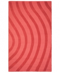 Abstract and absorbing, this rose-colored rug adds movement to any room. Playful, wavy lines reverberate against a warm red ground, resounding with personality in your home.