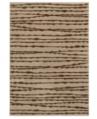 Distressed lines in deep brown create an exciting and contemporary design in the Tribecca area rug from Sphinx. Crafted of tough polypropylene for natural durability and effortless softness underfoot. (Clearance)