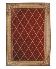 Infusing classic design with modern flair, this rug features a striking lattice pattern studded with rosettes on a deep sienna ground, bordered with floral and vine accents. A premium wool weave imparts rich texture and indulgent softness.