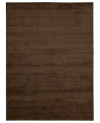 Skilled hand-carving creates an absorbing geometric block pattern on this premium Nourison area rug. Crafted with the timeless art of Tibetan hand-knotting, this deep brown piece features a soft blend of wool and Luxcelle fibers for a distinctive, satiny texture and sheen.