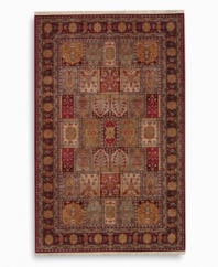 A striking example of classic Bakhtiyari designs, this rug features organic motifs in a panel design of reds, greens and golds, finished with a rosette border. A special antique wash enhances and harmonizes the burnished colors to create a rich vintage finish. Woven in the USA of luxuriously soft premium worsted New Zealand wool.