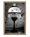 Shine a light on the past with this framed canvas print by Ashley Beck. A shade with vintage blooms and crystal beading caps off an exquisite lamp while floral wallpaper completes the scene with antique elegance.